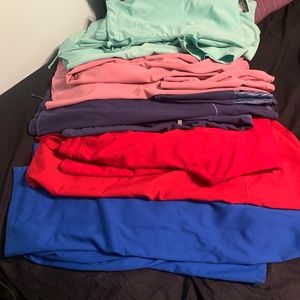 Scrub tops, scrub pants, and sets.